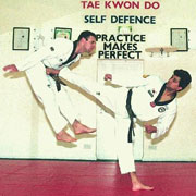 Grandmaster Vohra 4rth Dan demonstrating side kick with Derry McCourt 3rd Dan 1997